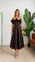Front view of woman wearing brown off-shoulder ruffle corset midi dress