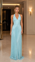 Front view of ice blue halter plunge evening gown with shimmering bodice and pleated fringe skirt