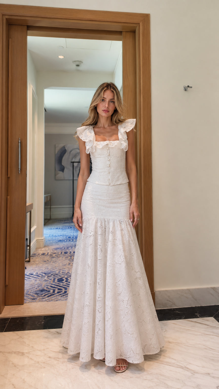 Model wearing white lace ruffle crop top and mermaid maxi skirt set, front view