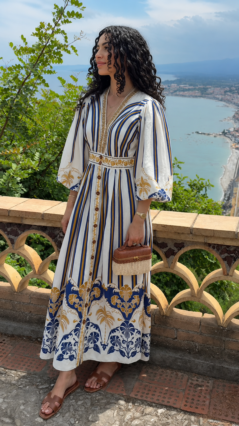 Front view of white bohemian print V-neck maxi dress with blue and gold border details