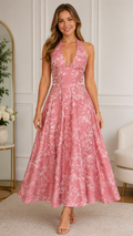 Front view of blush pink halter backless floral jacquard midi dress with full skirt