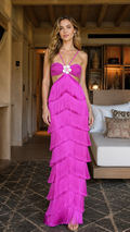 Front view of fuchsia tiered fringe cutout maxi dress with floral center accent