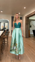 Front view of model wearing teal and mint two-tone strapless evening dress