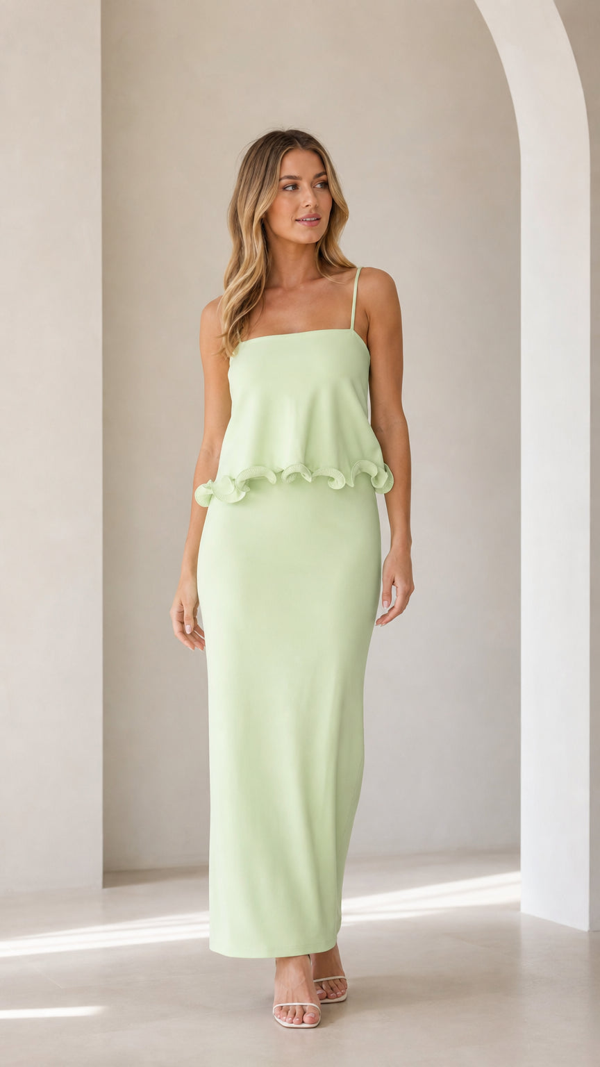 Model wearing sage green sleeveless ruffle trim maxi camisole dress from the front