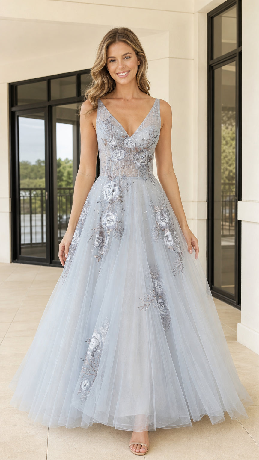 Front view of light blue V-neck tulle evening gown with floral embroidery