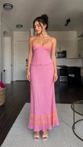 Model wearing pink lace trim satin camisole and maxi skirt set from front
