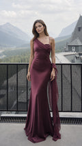 Front view of burgundy one-shoulder satin evening dress with draped scarf