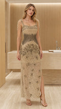Front view of model wearing gold beaded evening dress