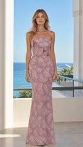 Front view of model wearing mauve beaded strapless mermaid evening gown