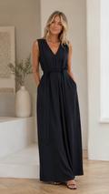 Front view of black sleeveless V-neck belted maxi dress with pockets