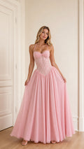 Model wearing pink halter neck lace corset long evening dress front view