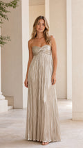 Front view of model wearing gold metallic pleated strapless maxi dress