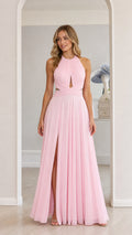Model wearing pink chiffon halter maxi dress with front slit, front view