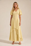 Front view of model wearing yellow V-neck flutter sleeve maxi dress