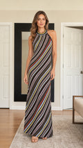 Front view of model wearing black diagonal stripe halter neck maxi dress