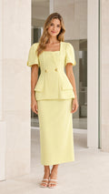 Front view of yellow square neck peplum top and midi skirt set