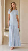 Front view of model wearing light blue pearl-button textured knit maxi dress