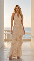 Front view of model wearing champagne halter ruffle maxi dress