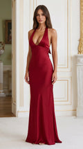 Model wearing Burgundy satin halter deep v-neck maxi dress from the front
