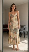 Front view of woman wearing beige vintage floral satin slip midi dress
