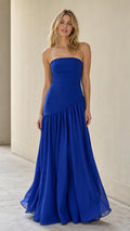Front view of model wearing royal blue strapless maxi dress