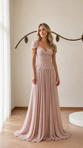 Front view of model wearing blush pink beaded chiffon evening gown