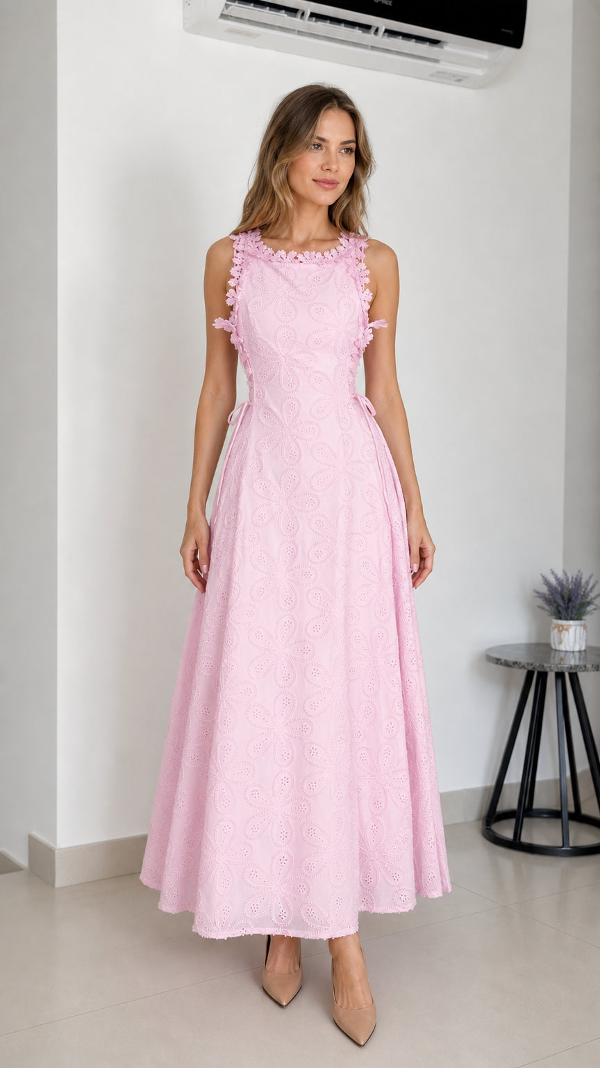 Front view of model wearing pink embroidered eyelet maxi dress