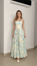 Model wearing ivory floral maxi dress from the front