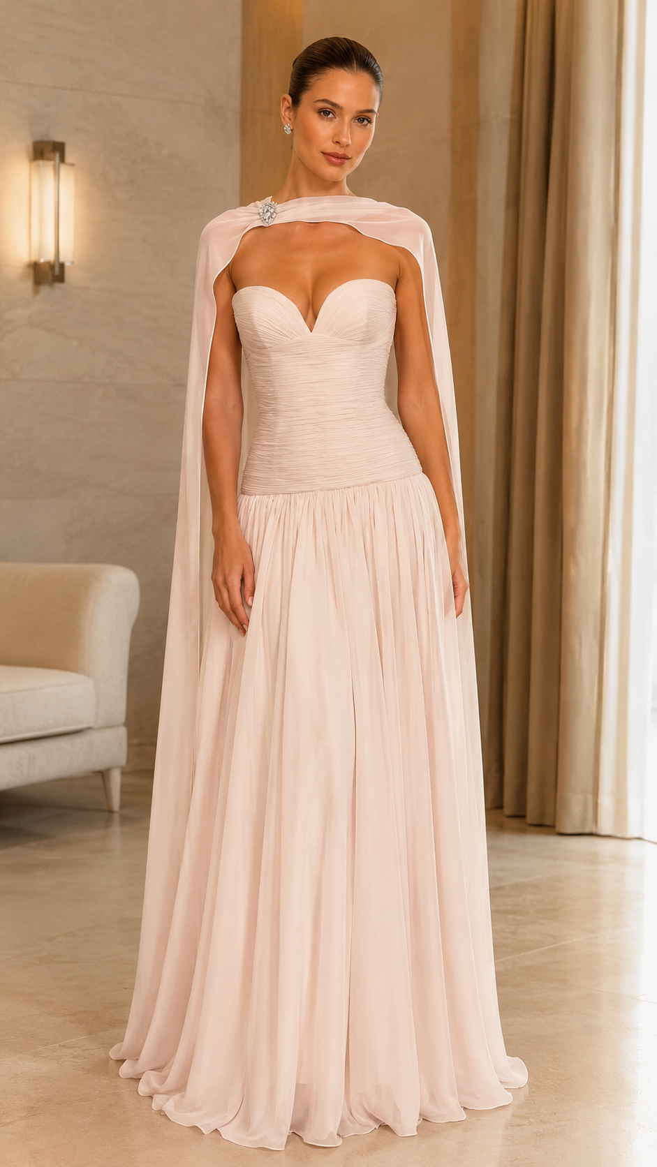 Front view of blush sweetheart cape evening gown with fitted bodice and flowing maxi skirt
