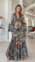 Front view of model wearing multi-color boho crop top and maxi skirt set