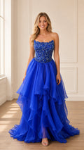 Front view of model wearing royal blue strapless beaded evening gown