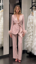 Model wearing pink satin feather cuff blazer and trousers set front view