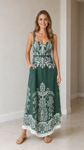 Model wearing green botanical print maxi dress from front