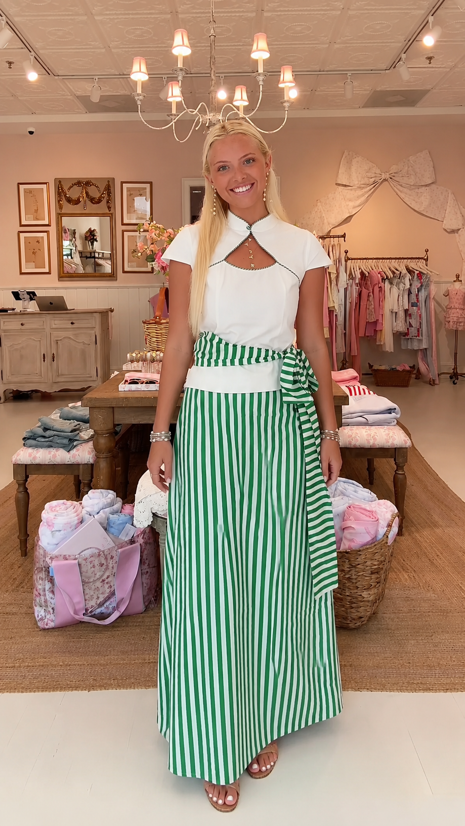 Front view of green striped maxi dress with white cape collar bodice and tie waist