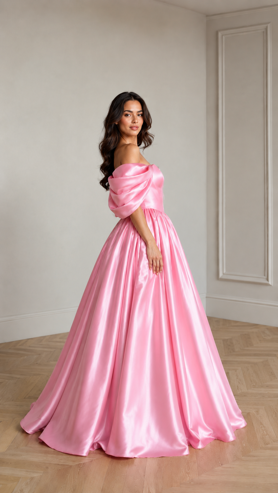 Side view of pink off-shoulder formal ball gown with puff sleeves and sweeping skirt