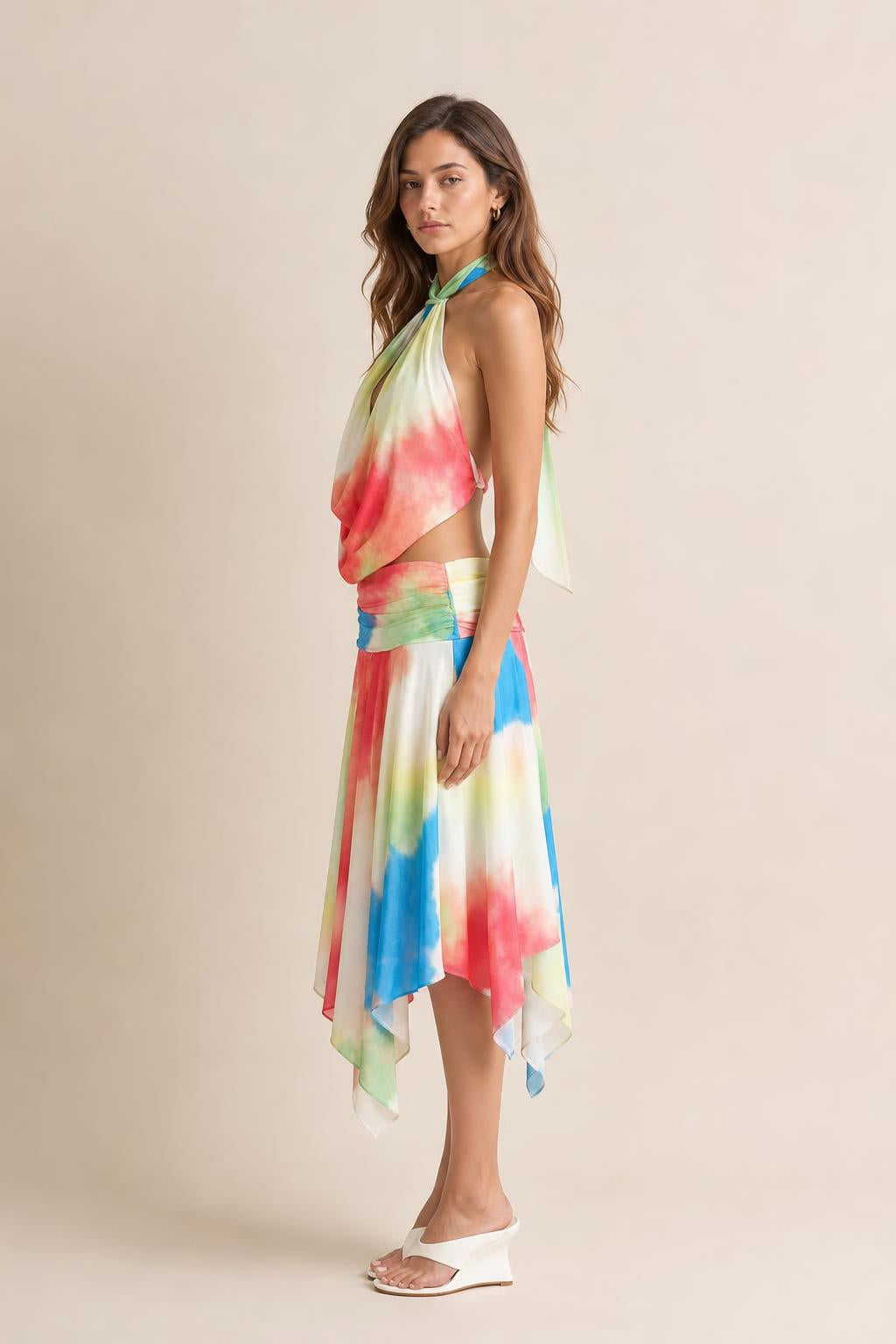 Side profile view of model in multi-color tie-dye dress