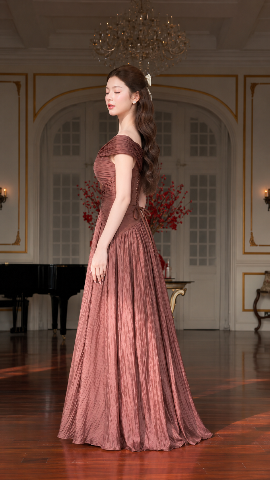 Side view of dusty rose floor-length formal gown with ruched bodice and flowing skirt