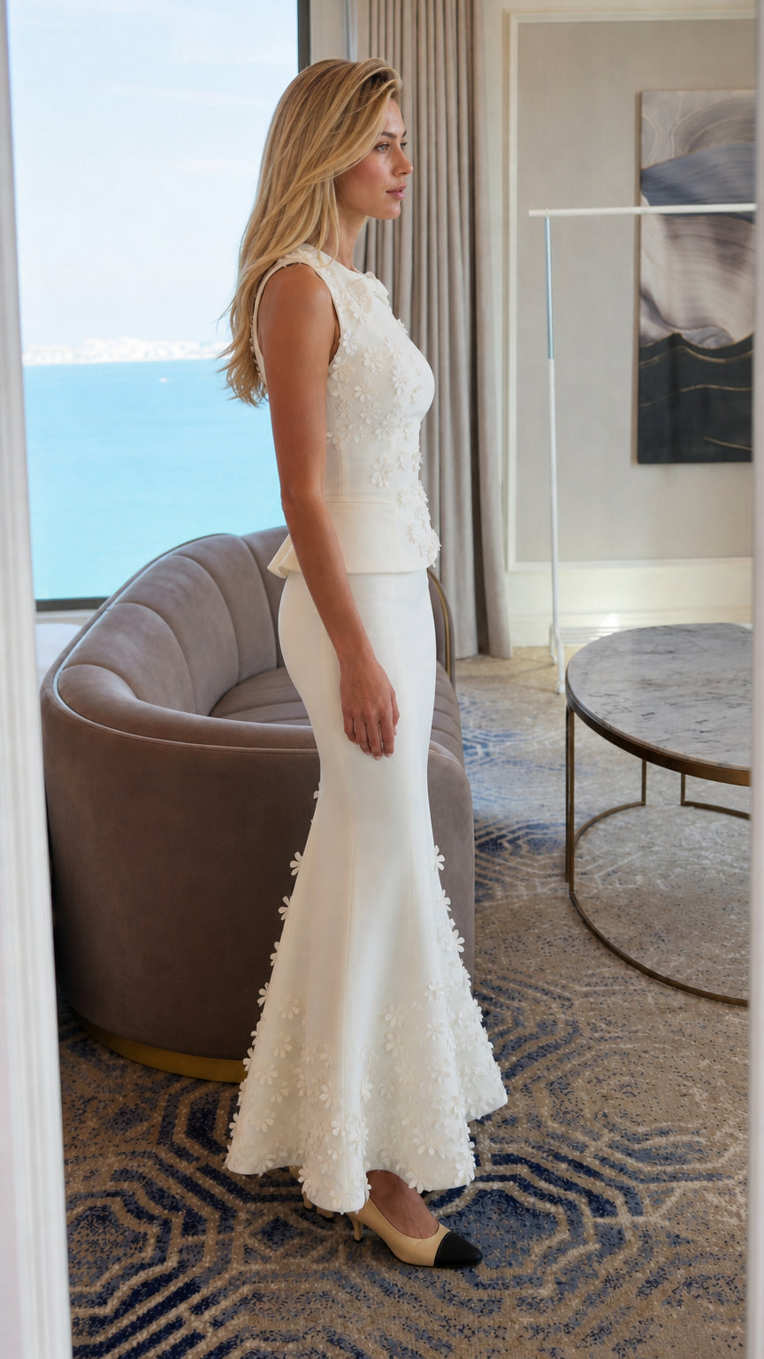 Side profile view of white floral maxi dress