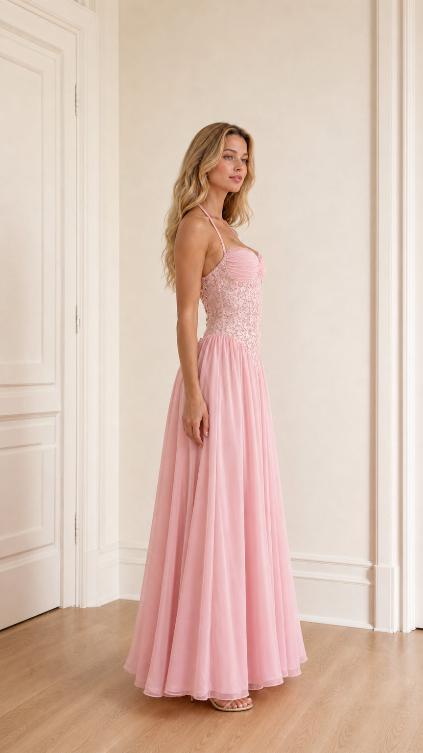 Model wearing pink evening dress side view