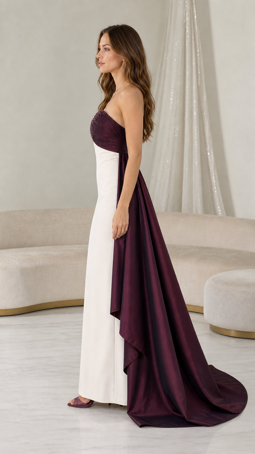 Side profile view of burgundy and white evening gown