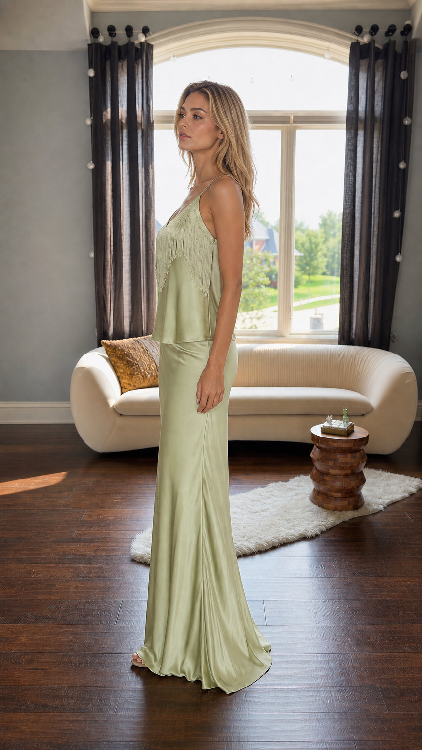 Side profile of model in sage green satin two-piece set
