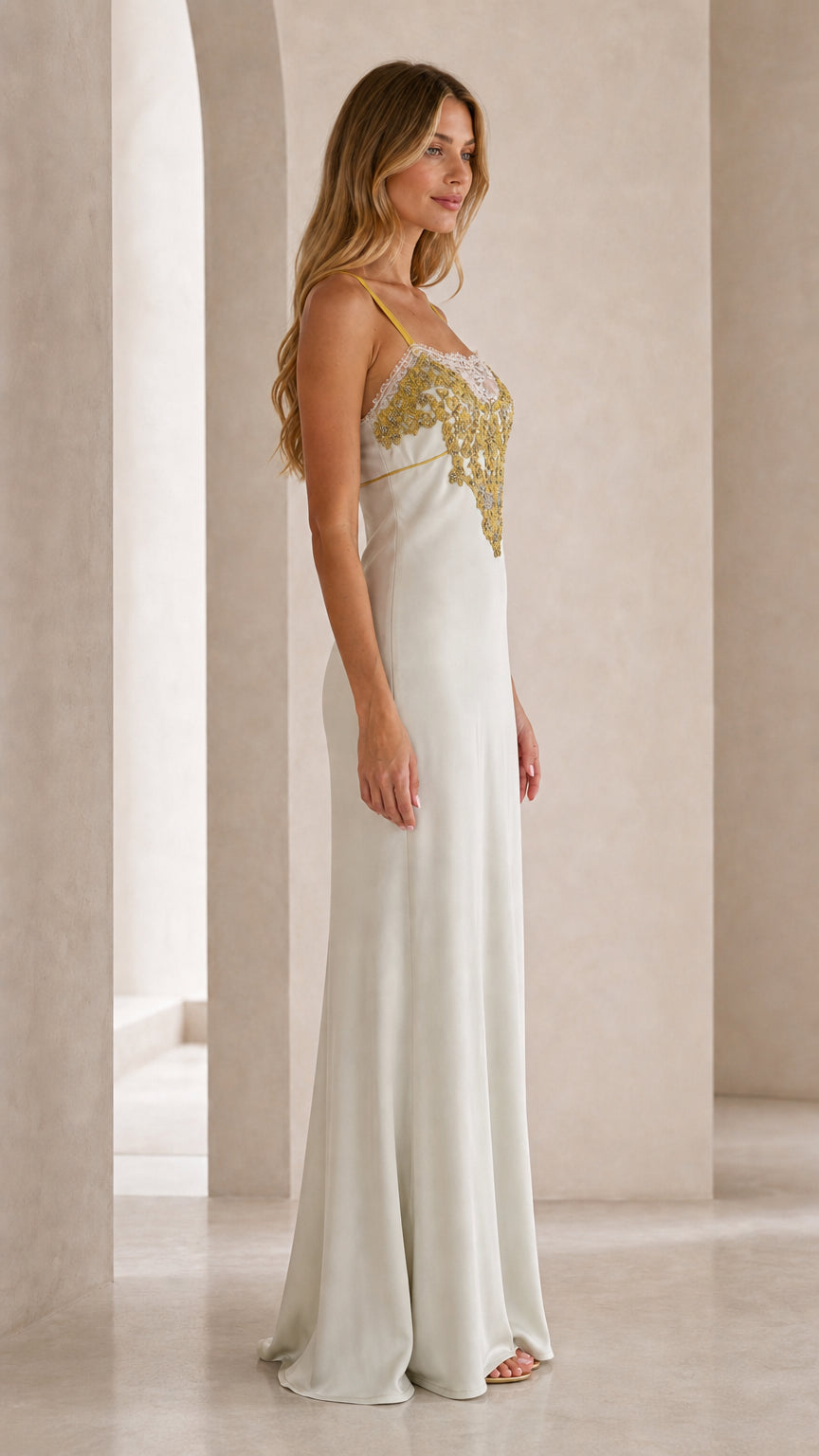 Side profile view of ivory satin maxi dress