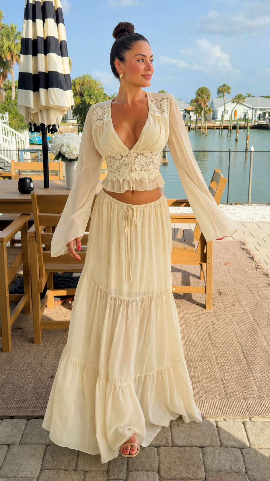 Full front view of cream boho two-piece skirt set with deep V neckline and flowing maxi skirt