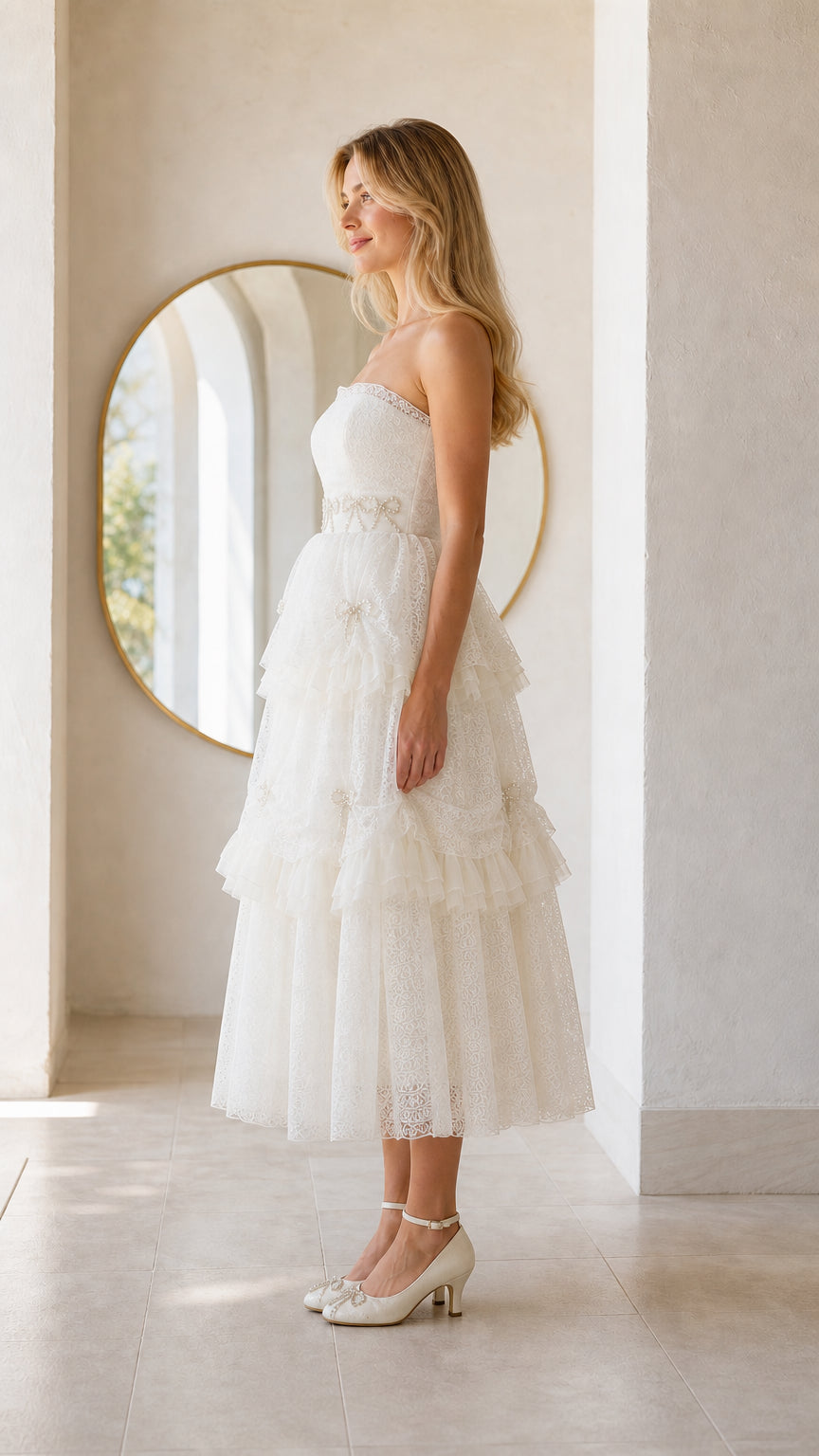 Side profile view of woman wearing white strapless midi dress