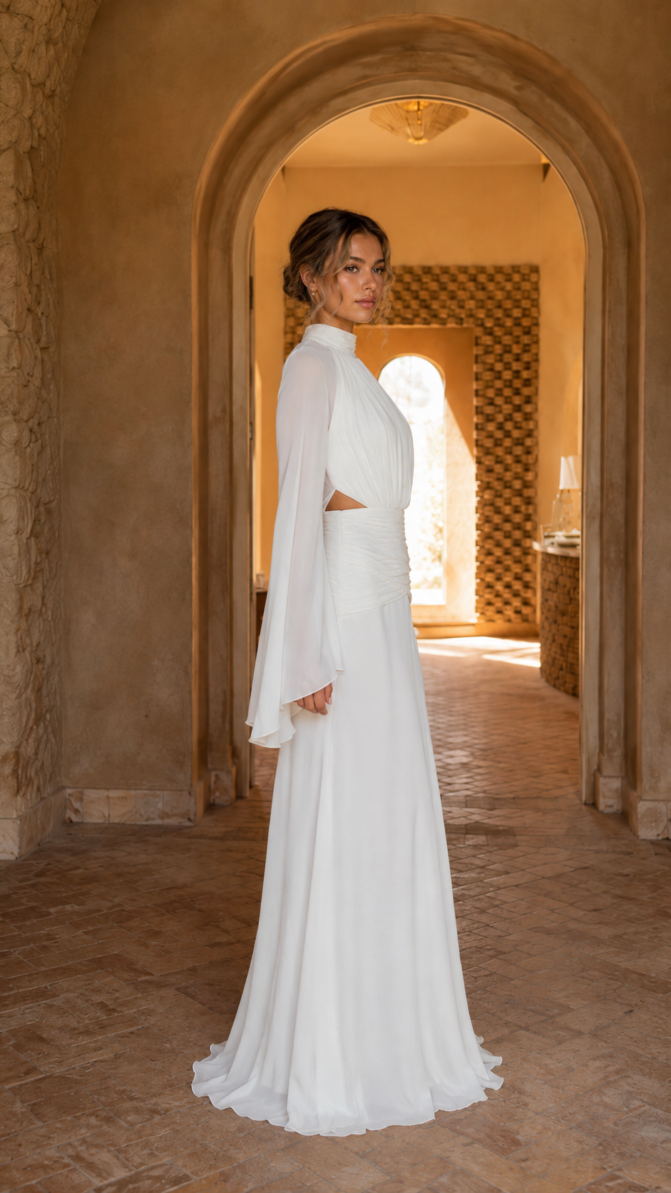 Side view of ivory floor-length gown with gathered bodice and flared sleeves
