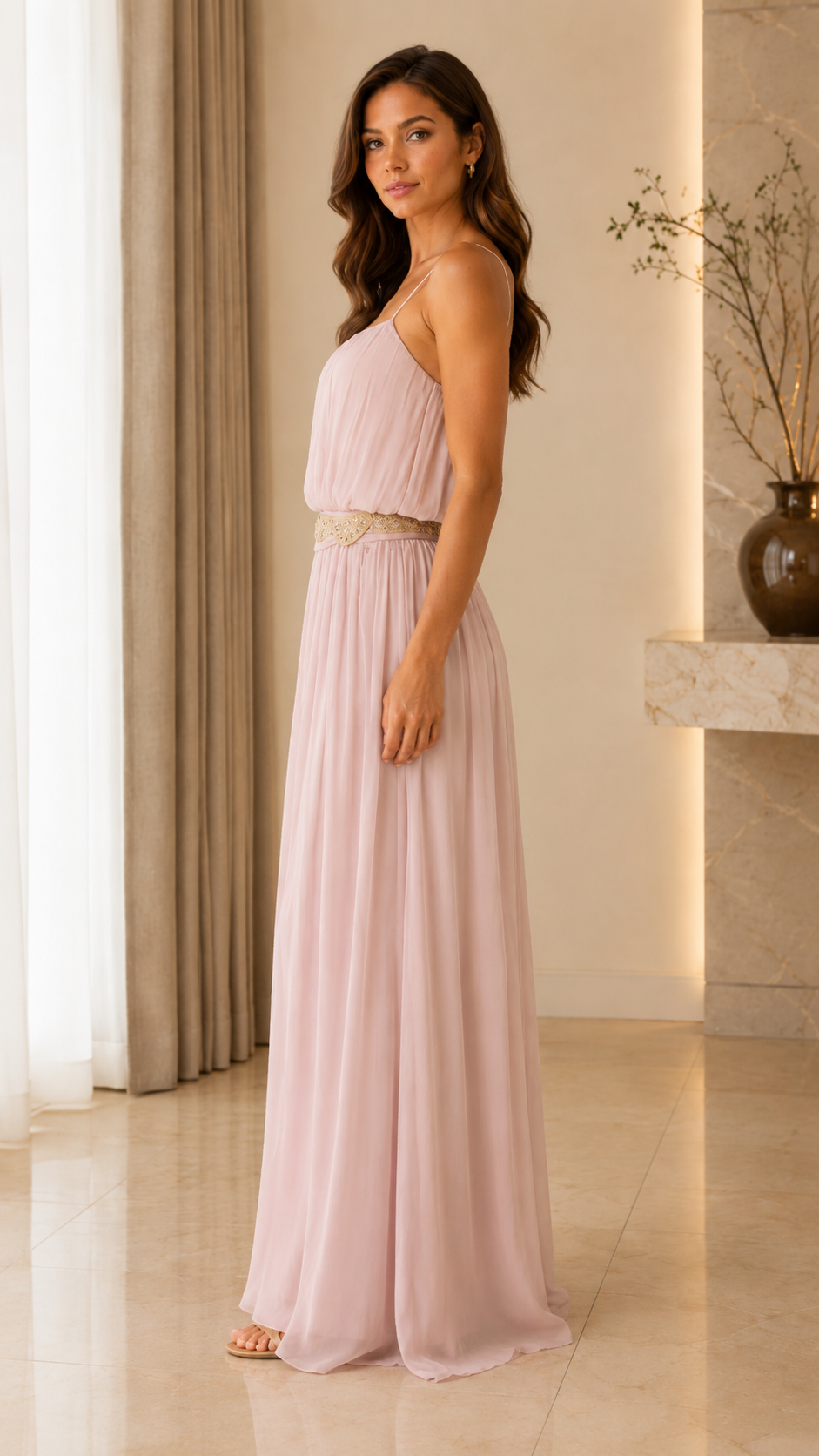 Side view of blush pink flowy maxi dress with gathered bodice and pleated skirt