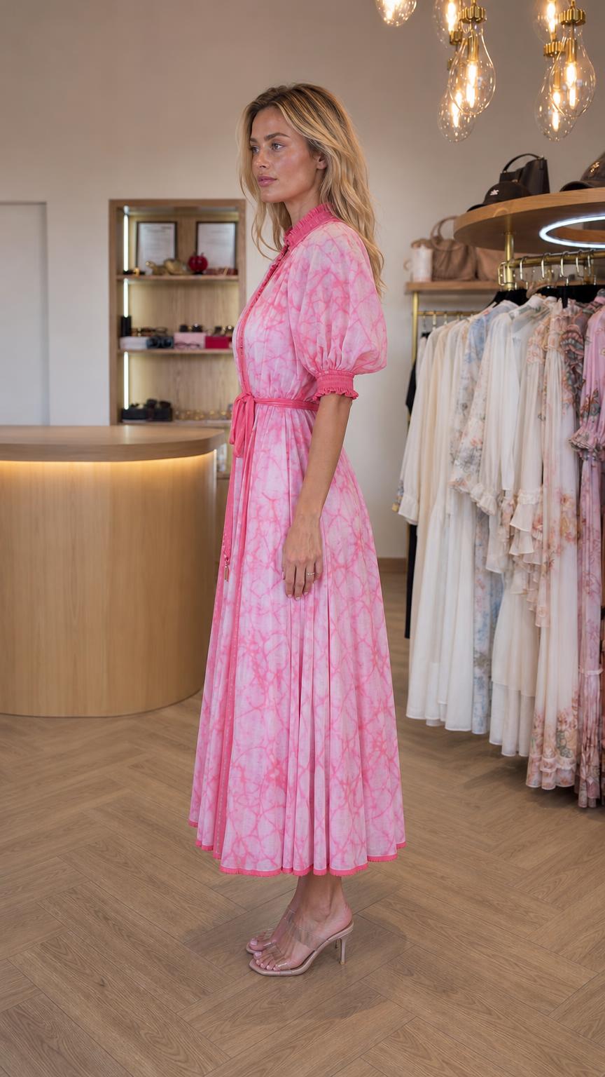 Side view of model wearing pink tie dye midi dress