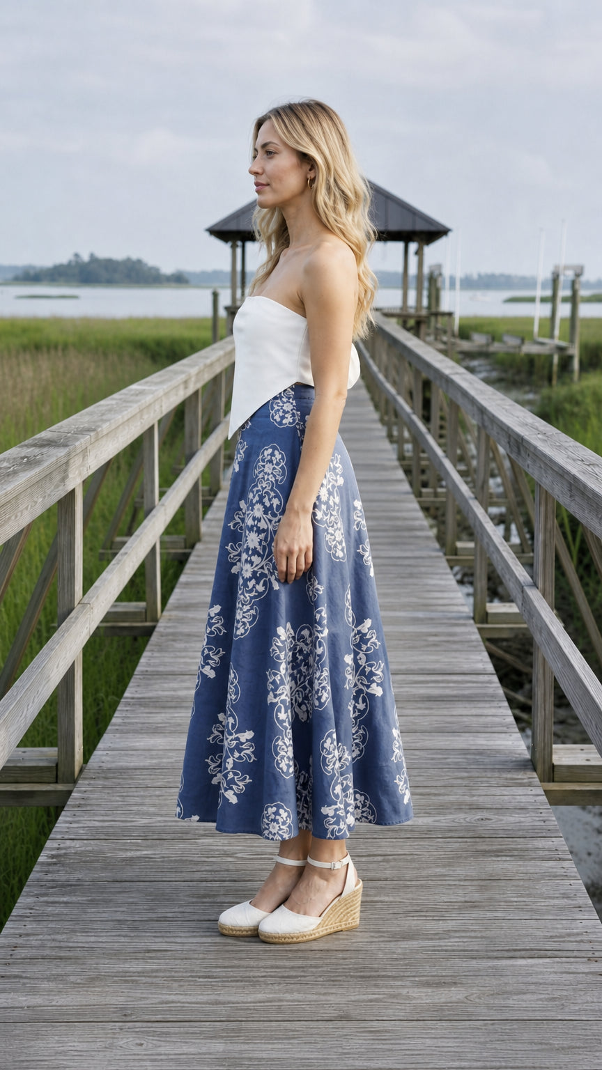 Side profile view of blue floral midi skirt on pier