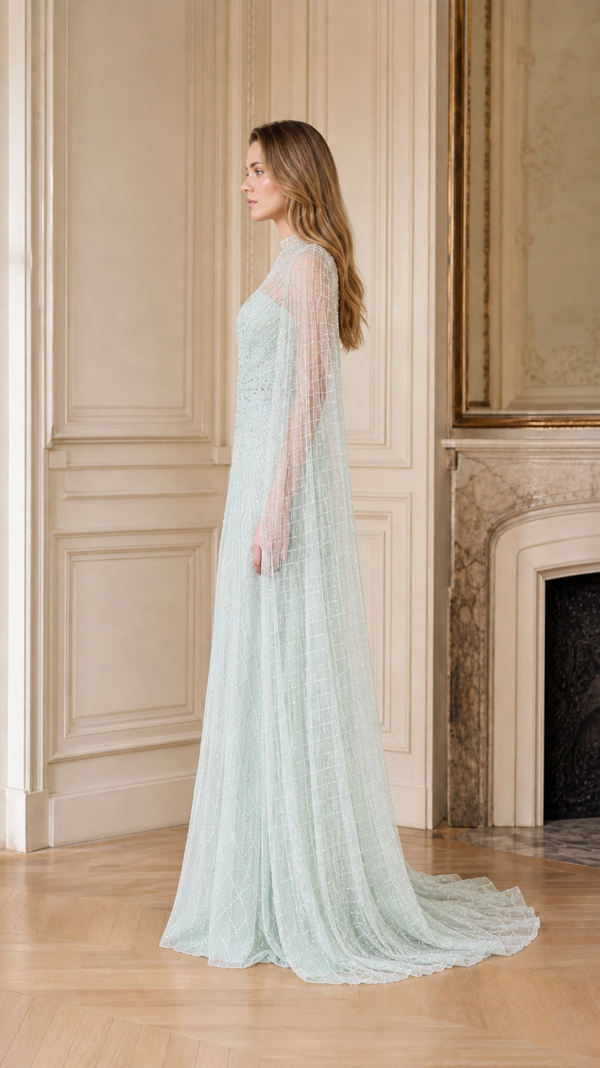 Side profile of sage green formal gown with cape