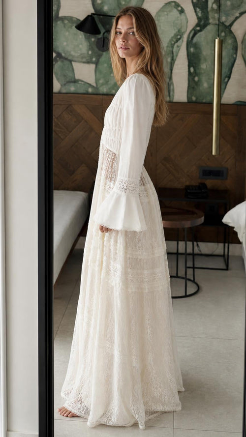 Side profile of model in white lace maxi set